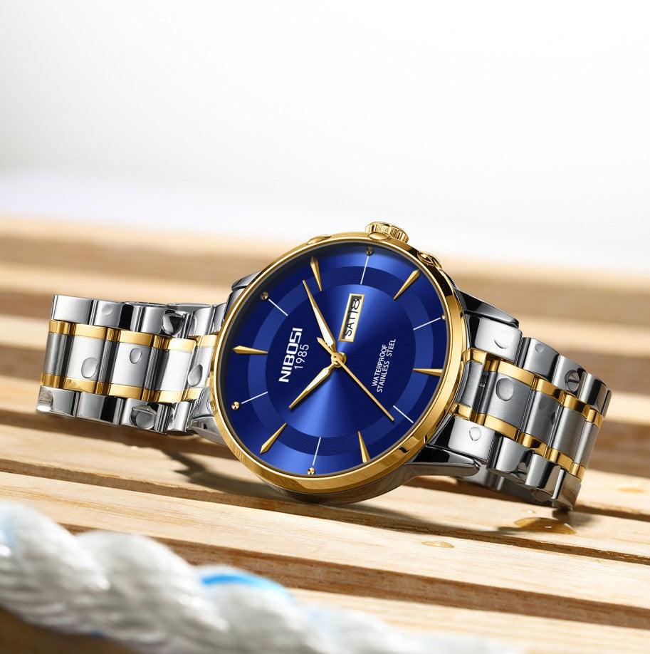 Relógio Nibosi Minimalista Masculino Signature Pulseira de Aço Inoxidável Prata e Dourado Com Visor Azul