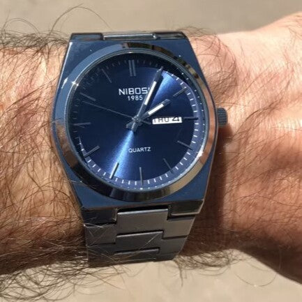 Relógio Nibosi Masculino Minimalista 2658 Com Pulseira de Aço Inoxidável Prata e Visor Azul