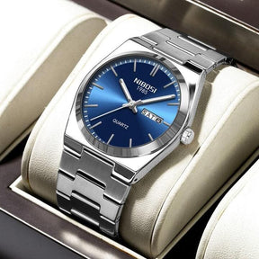 Relógio Nibosi Masculino Minimalista 2658 Com Pulseira de Aço Inoxidável Prata e Visor Azul